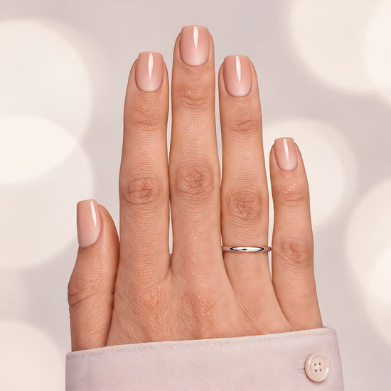 Professional top-down shot of short square nude pink ombre press-on nails with a flawless gradient finish.