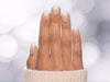 A top-down photo of nude white ombre extra short round press-on nails, showing the elegant gradient perfect for weddings or everyday wear.