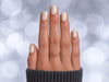 Professional top-down shot of short square white pearlescent chrome press-on nails with a futuristic, high-gloss pearl finish.