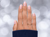 A top-down view of sheer soft pink short almond press-on nails, featuring a subtle, glossy tint for a minimalist manicure.